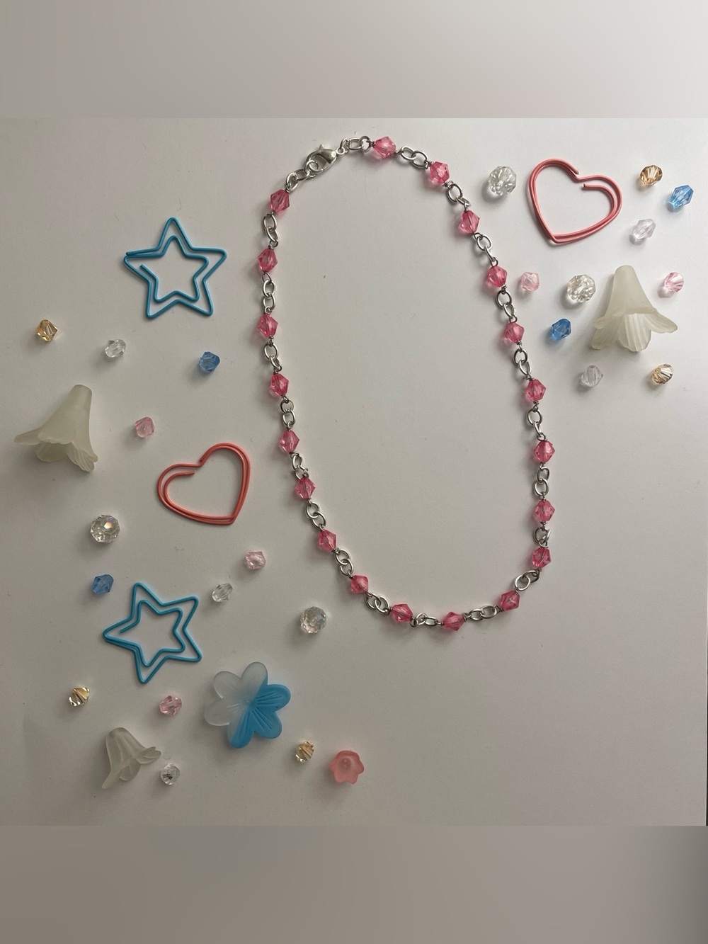 Silver chain necklace with pink beads